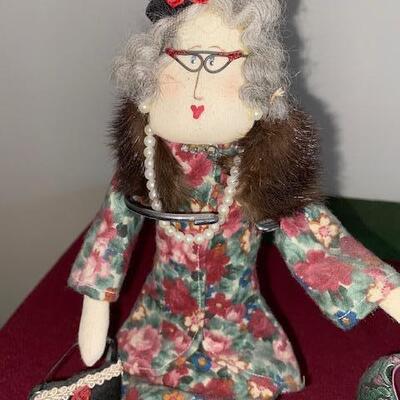 Lot 692 - Doll and decorative shoes