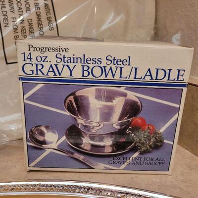 Lot 4: (2) New Serving Trays and Progressive Stainless Gravy Bowl/Ladle
