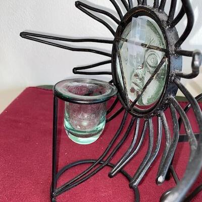 Lot 715 - metal plate racks and sun candle holder