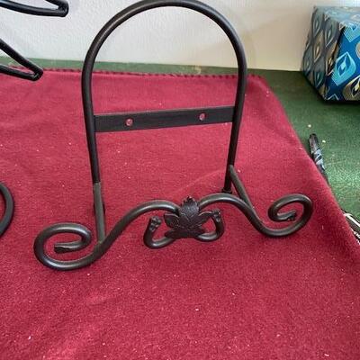 Lot 715 - metal plate racks and sun candle holder