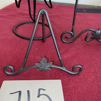 Lot 715 - metal plate racks and sun candle holder
