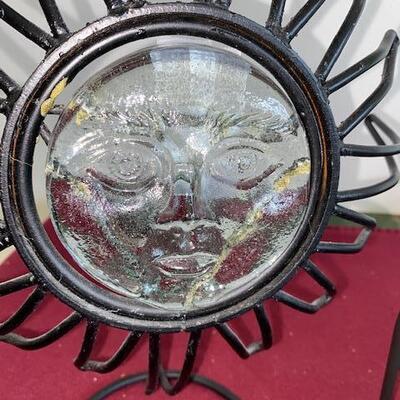 Lot 715 - metal plate racks and sun candle holder