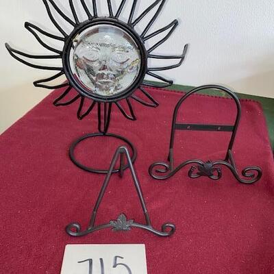 Lot 715 - metal plate racks and sun candle holder