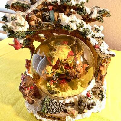LOT 141  LARGE RESIN SNOWGLOBE SANTA CHECKS HIS LIST FORREST ANIMALS
