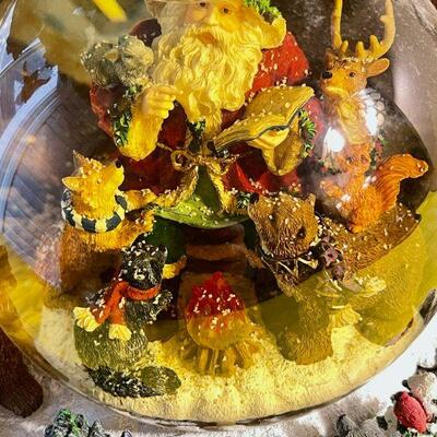 LOT 141  LARGE RESIN SNOWGLOBE SANTA CHECKS HIS LIST FORREST ANIMALS