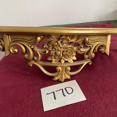 Lot 770 - Resin Gold Shelf. 