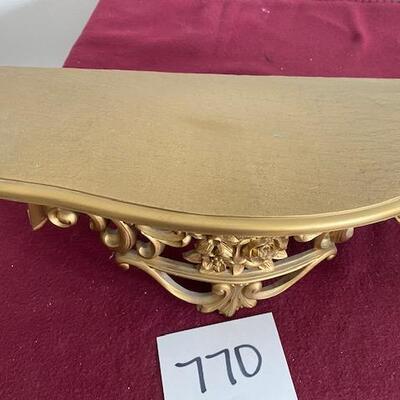 Lot 770 - Resin Gold Shelf. 