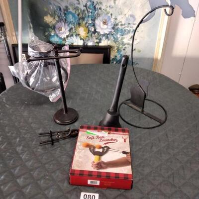 Lot 80 Cast Iron Bell and wheelbarrow, bathtowel racks