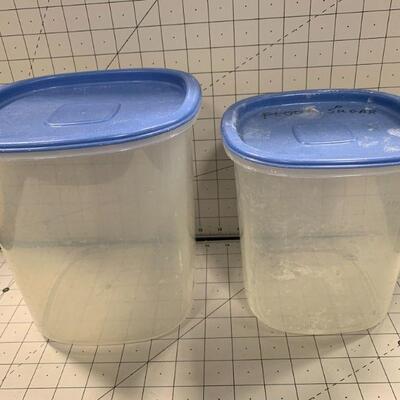 2 plastic containers with blue lids