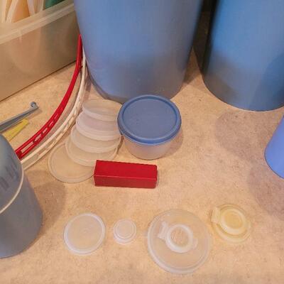 Lot 65: Blue Tupperware and Miscellaneous Tupperware Lids & Accessories 