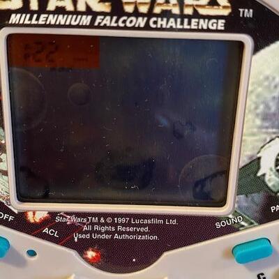 Lot 916 - Star wars Millennium Falcon Challenge handheld game