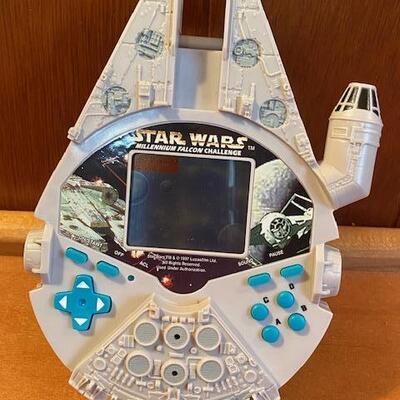 Lot 916 - Star wars Millennium Falcon Challenge handheld game