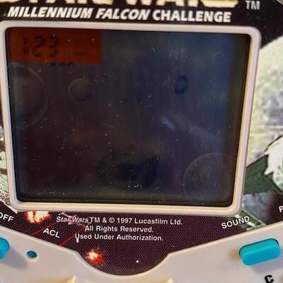 Lot 916 - Star wars Millennium Falcon Challenge handheld game