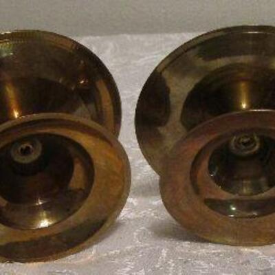 #25 One brass candle holder and 3 brass looking candle holders