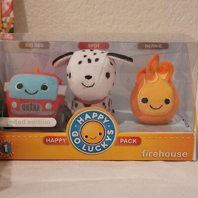 Lot 264: New Candy Land Book & Itty Bittys and (3) Happy Go Luckys Happy Packs