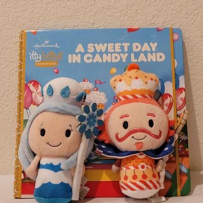 Lot 264: New Candy Land Book & Itty Bittys and (3) Happy Go Luckys Happy Packs