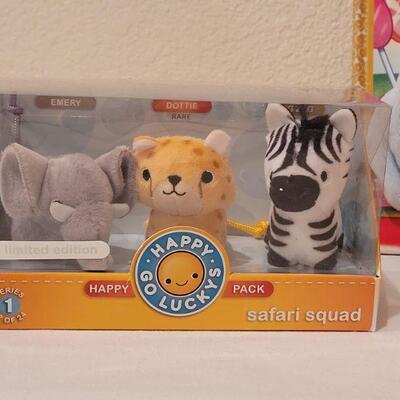 Lot 264: New Candy Land Book & Itty Bittys and (3) Happy Go Luckys Happy Packs