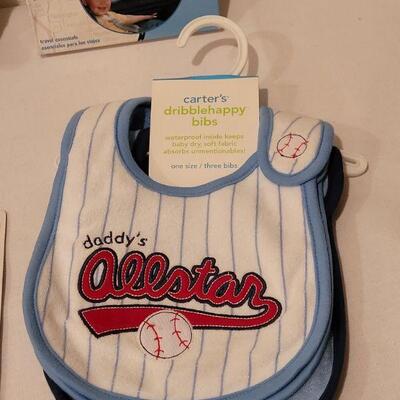 Lot 282: NEW Baby Boy Bibs, Toy, Plushie, Utensils and Window Shade