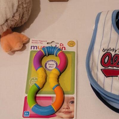 Lot 282: NEW Baby Boy Bibs, Toy, Plushie, Utensils and Window Shade