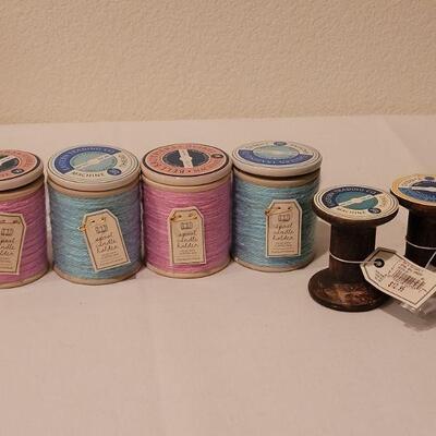 Lot 286: New (4) Small Spool Candles and Spool Deco Hangers