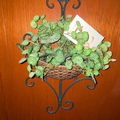 Lot 1002 - metal and rattan plant holder