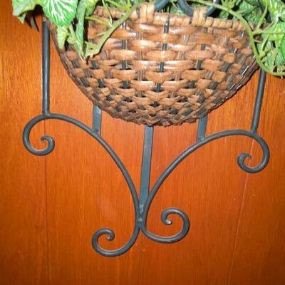 Lot 1002 - metal and rattan plant holder
