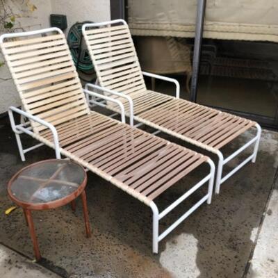 Lot 5. Pair of lounge chairs and one small side table--$15