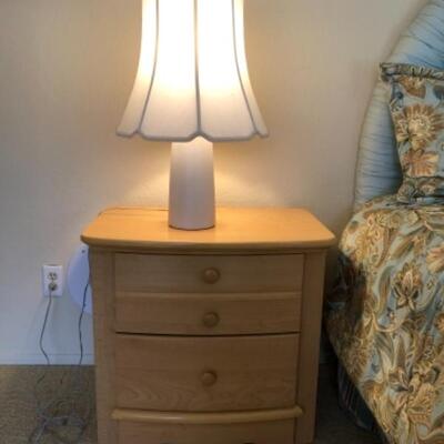 Lot 8. Queen Sealy Posturpedic queen bed, upholstered headboard, pair of nightstands, pair of lamps, 5 drawer highboy (38â€L x 20â€W)...