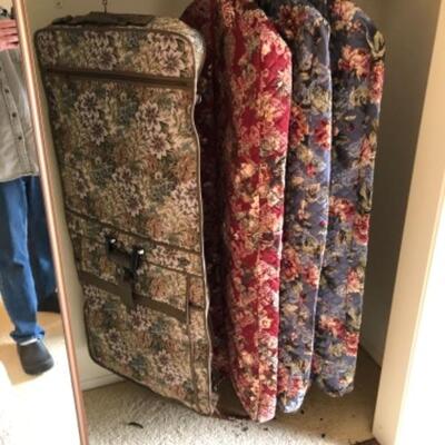 Lot 14. Four floral garment bags (3 unused) with matching carry-ons and assorted hangers--$85