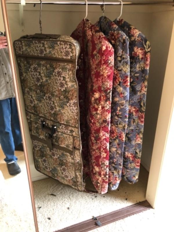 Lot 14. Four floral garment bags (3 unused) with matching carryons and