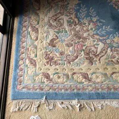 Lot 15. Oriental motif area rug with pink and blue hues (approx.. 8â€™x10â€™)--$75