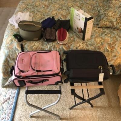 Lot 19. Travel Accessories: Two carry-ons, luggage scale, 5 cosmetic bags, 2 laundry bags, 2 luggage racks, memory foam travel pillow--$30