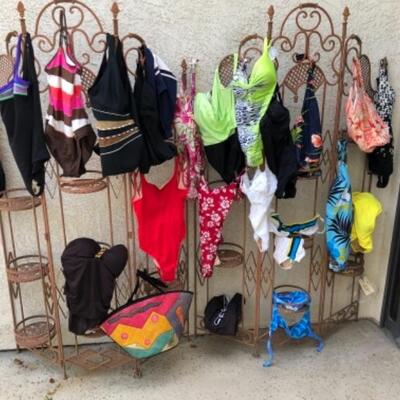 Lot 23. Twenty-two size large womenâ€™s bathing suits, two mumus, cover-up, vacation lounge wear, foldable sun hats, etc.--$145