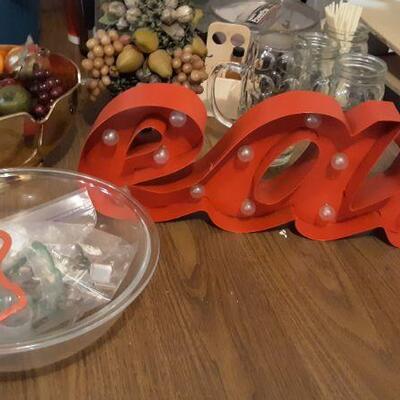 EAT LIGHT SIGN AND KITCHEN ITEMS