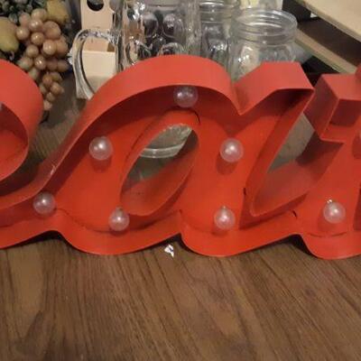 EAT LIGHT SIGN AND KITCHEN ITEMS