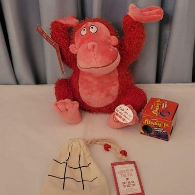 Lot 13: NEW Animated Monkey, Valentine's Tic Tac Toe & a Slinky