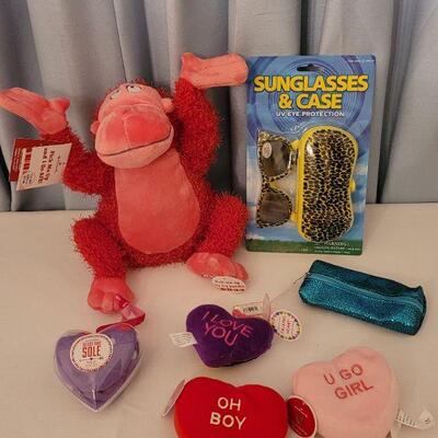 Lot 62. New Animated Valentine's Ape, Recordable Heart Keychain, Socks, Make Up Brushes and Pouch, Heart BeaN bags, Sunglasses &...