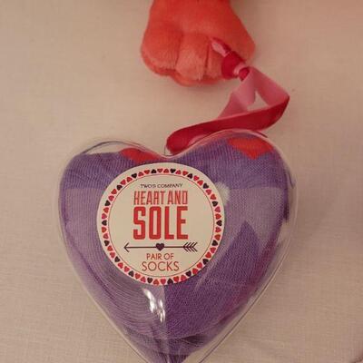 Lot 62. New Animated Valentine's Ape, Recordable Heart Keychain, Socks, Make Up Brushes and Pouch, Heart BeaN bags, Sunglasses &...