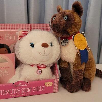 Lot 142: New Bell Interactive Story Buddy Dog with Book & CD and Disney's Tao Best in Show Cat