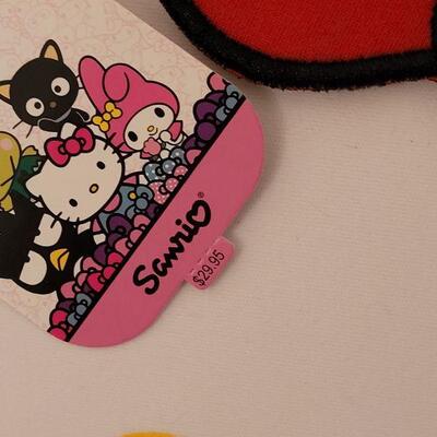 Lot 174: NEW Hello Kitty Plushie, Backpack, Pez and Lip Gloss