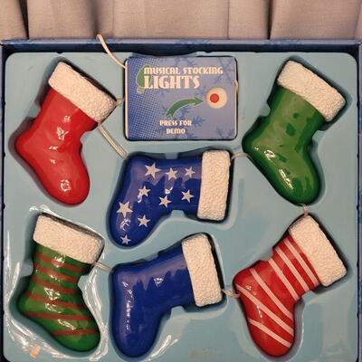 Lot 200: NEW Christmas Stocking Lights and New Socks