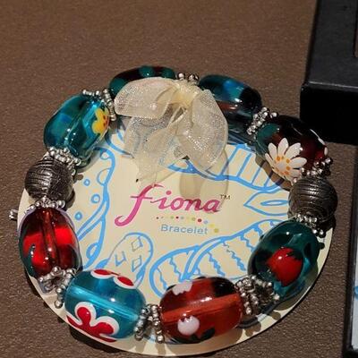 Lot 204: NEW Glass Dolphin Pendant Necklace and Glass Bead Bracelet 