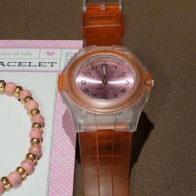 Lot 208: NEW Pink Watch and Heart and Tassel Bracelet 