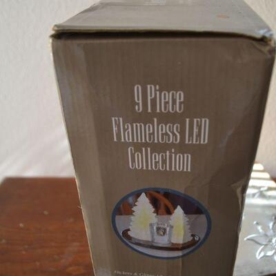 LOT 243  METAL BOX AND FLAMELESS CANDLES