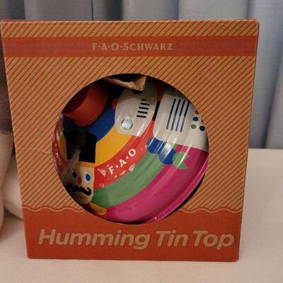 Lot 140: New FAO Spinning Top and Dog Plushie