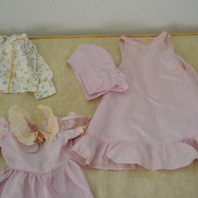 LOT 313  DOLL PARTS AND DOLL CLOTHING