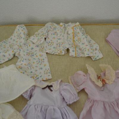 LOT 313  DOLL PARTS AND DOLL CLOTHING