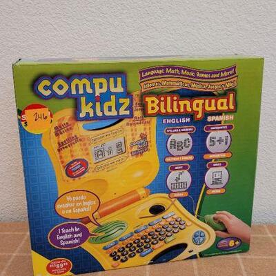 Lot 246: New COMPUKIDZ Bilingual MATH MUSIC GAMES and MORE!