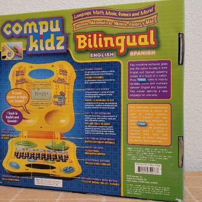 Lot 246: New COMPUKIDZ Bilingual MATH MUSIC GAMES and MORE!