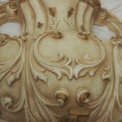 Lot 13 Plaster Faux wall fountain hangs on wall